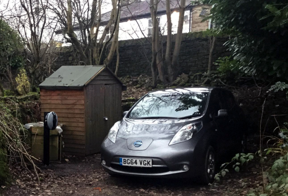 Pod Point charging next to Nissan Leaf